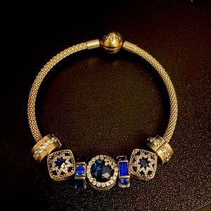 Pandora bracelet with 3 charms 2 clips and 2 separators